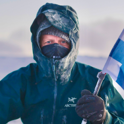 Close up of Ben in arctic conditions with his hood pulled up