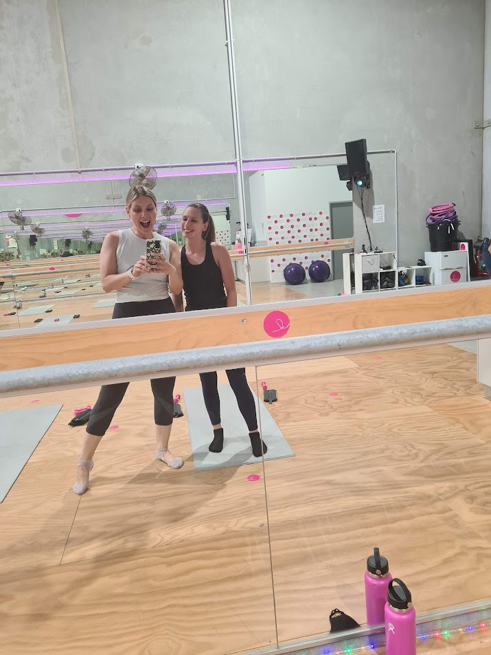 Abby taking selfie in a dance studio mirror