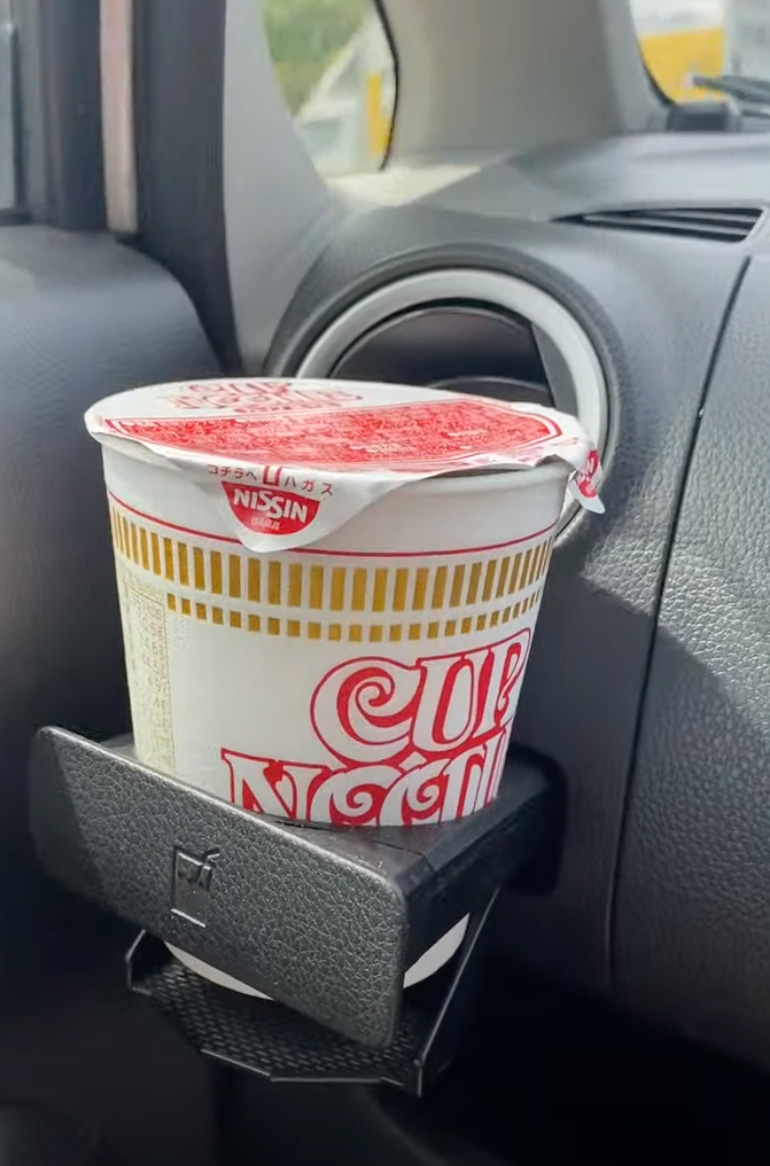 Ramen cup noodles in a car cup holder