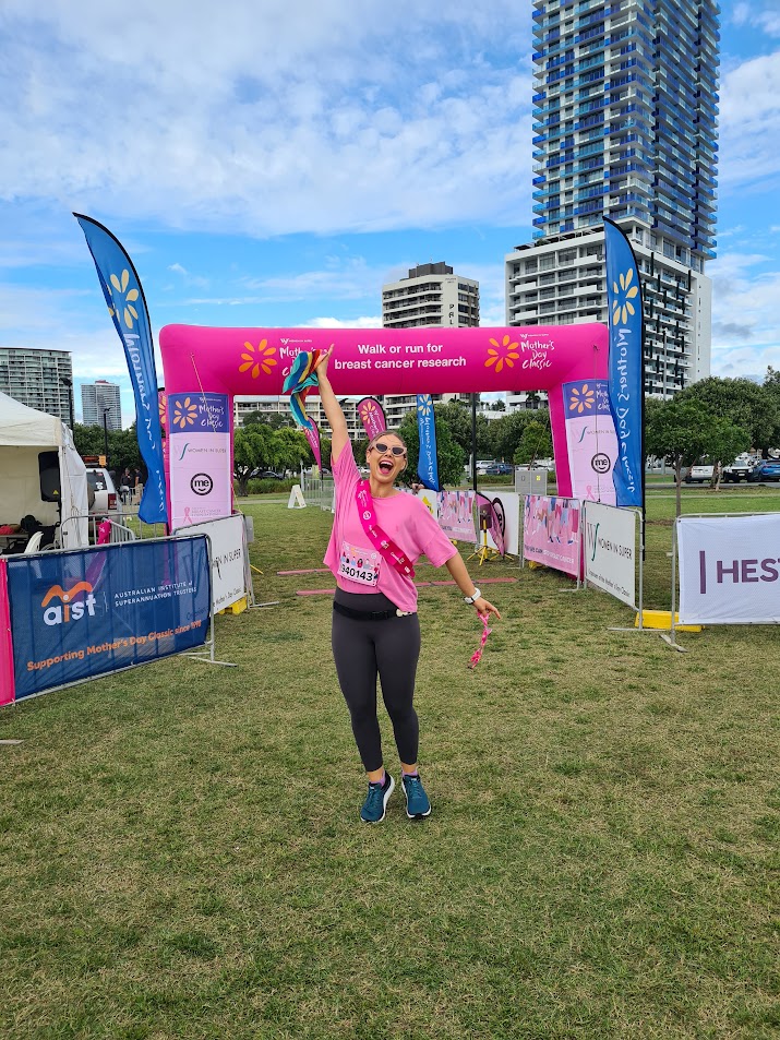 Abby at the finish line of a charity running event