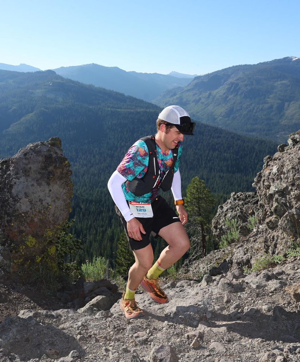 Ryan running with the mountains in the background