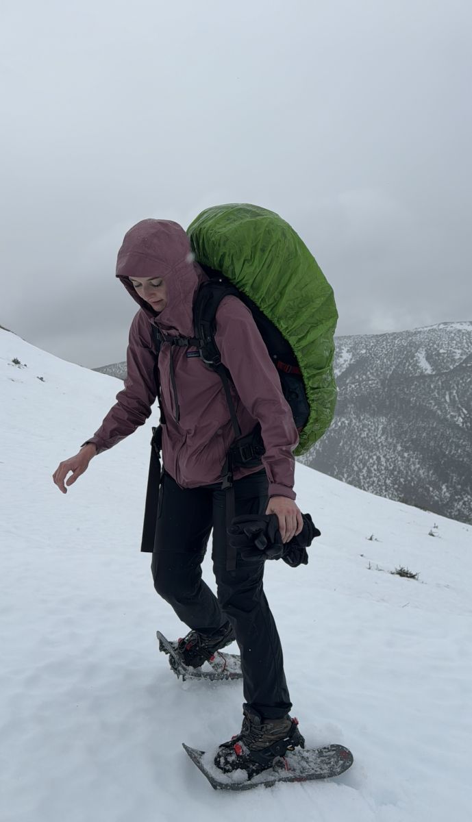 Sara hiking in the snow wearing Merrell Moab 3 with snowshoes