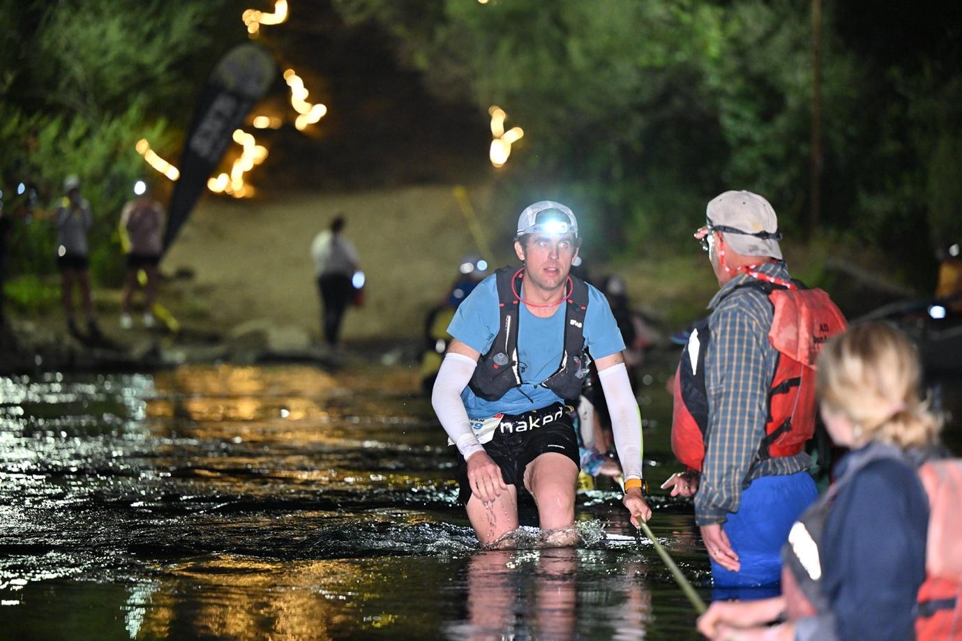 Ryan at a river crossing knee deep in water