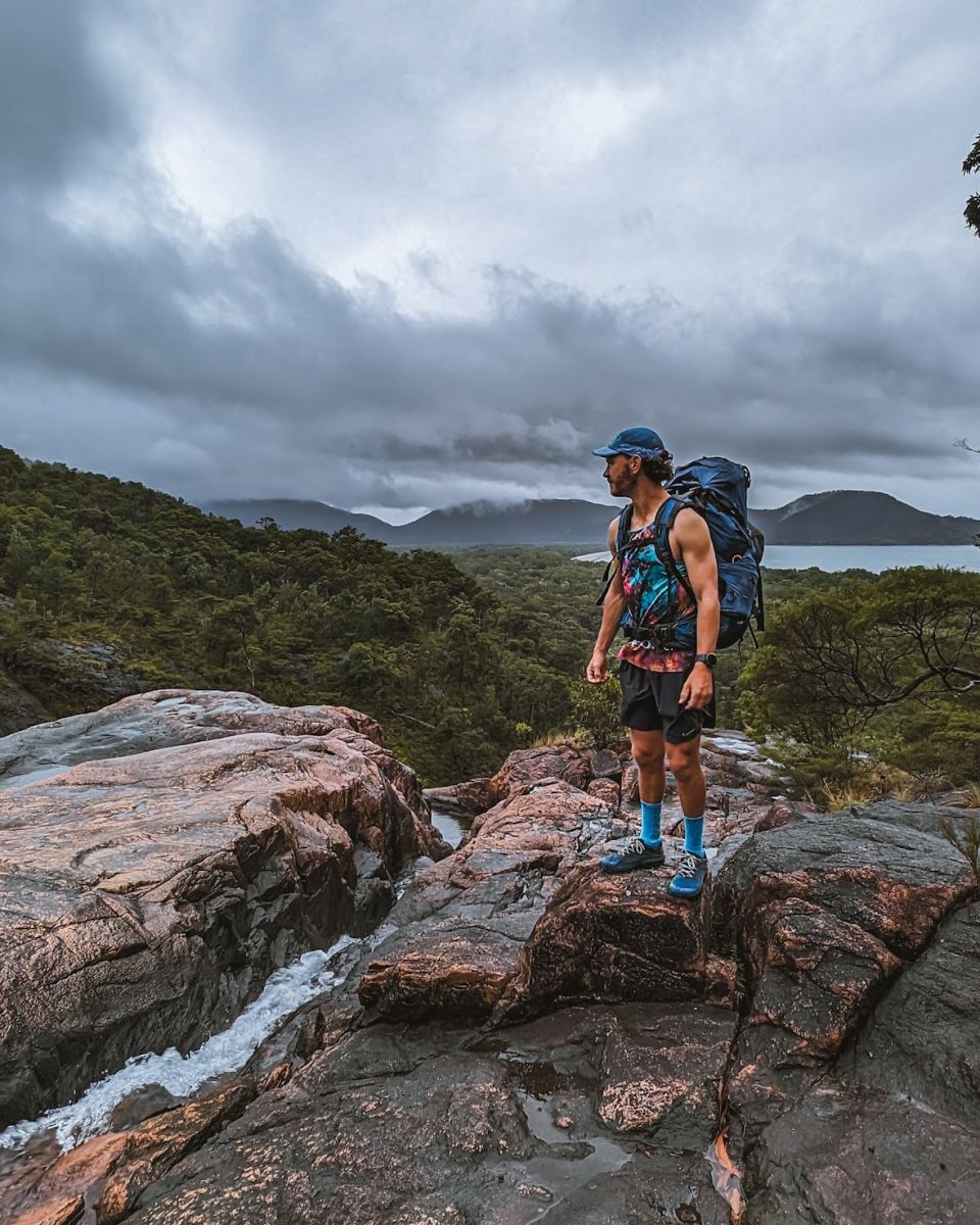 Brad on a lookout point wearing the Osprey Aether 65L pack