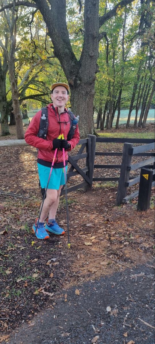 Reid with the Leki Ultratrail FX.One with trees and a river in the background